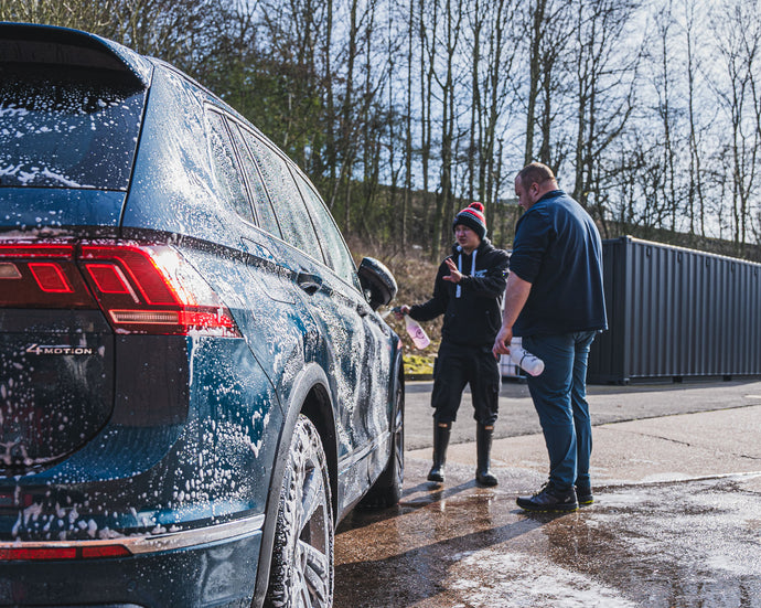 Nath and trainee outside talking about the detailing process