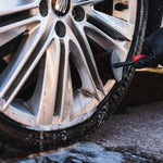 Wheel being cleaned with a brush