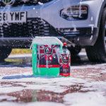 Bottle of Luxury Suds 5l and 500ml in front of the car